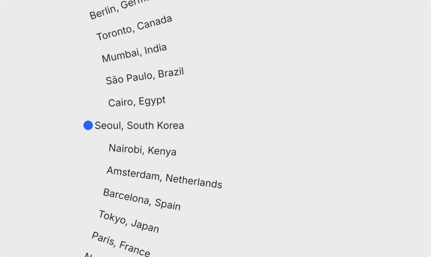Revolver Clock animation: a rotating list of city names with a blue dot indicator