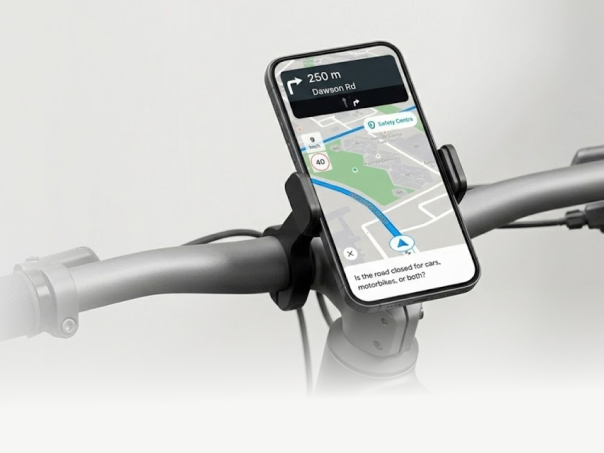 Motorbike rider with phone mounted on handlebar