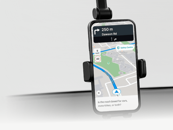 4-wheel driver in cab with phone on dashboard mount